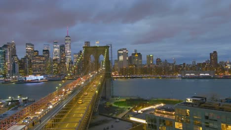 Magnificent-Beautiful-Dramatic-Aerial-Of-The-Brooklyn-Bridge-At-Night-In-New-York-City