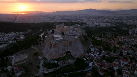 close up circling aerial shot of the acropolis at sunset