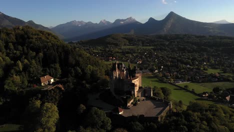 Dreamy-castle-surrounded-by-mountains-and-forest-in-Europe