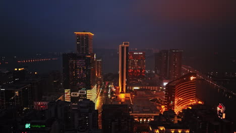 a view of a city at night from the top of a building