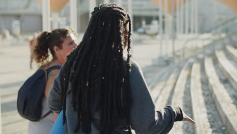 cheerful body positive women walking steps to sports centre