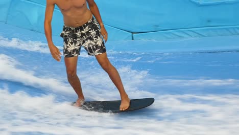 indoor surfing on artificial wave