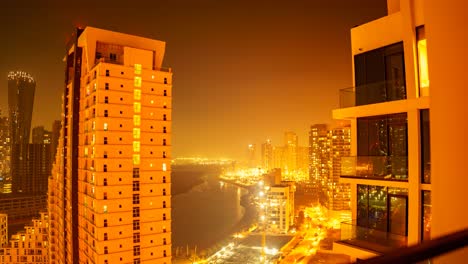 sunset to nighttime time lapse of al reem island, adu dhabi, united arab emirates looking along a canal by the mangrove forest and a construction crane