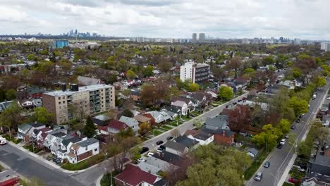 drone flying through a grey, overcast and foggy toronto neighborhood in early spring