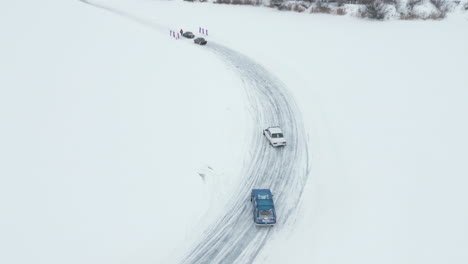cars racing on a frozen lake