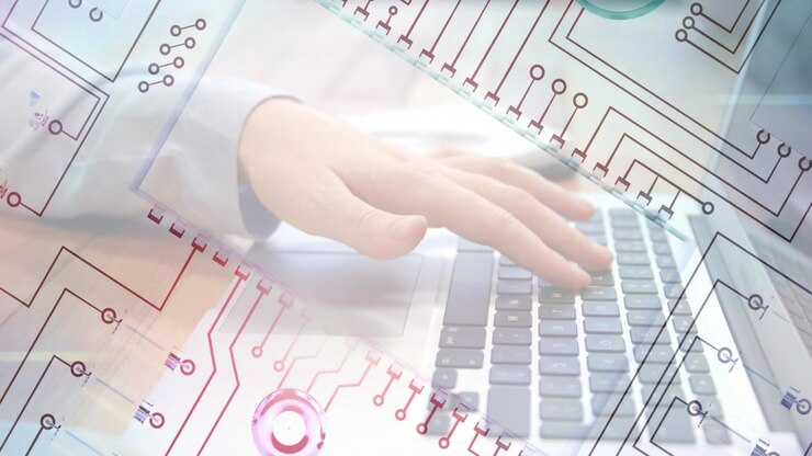 Person Typing on Laptop with Digital Circuit Board Overlay