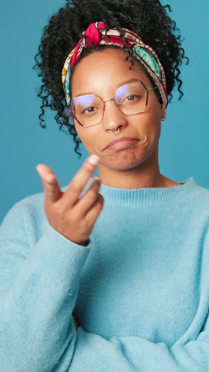 Expressive Young Woman with Curly Hair Gesturing and Posing