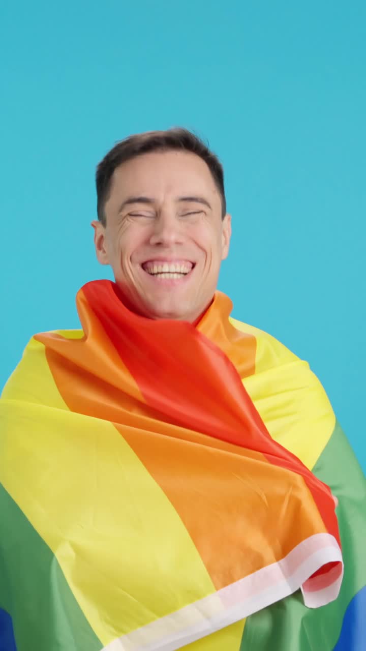 Man with LGBTQ pride flag
