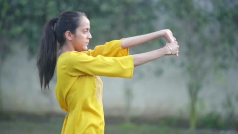 Indian-girl-doing-palm-and-hand-exercise