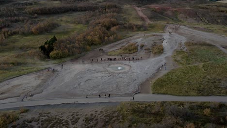 steaming geyser crater, iceland. aerial orbiting