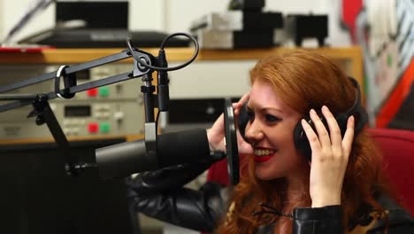 pretty student recording a song in the studio