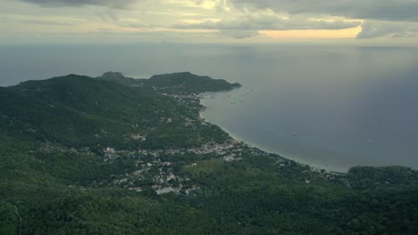 Aerial View of Tropical Island Coastline at Sunset