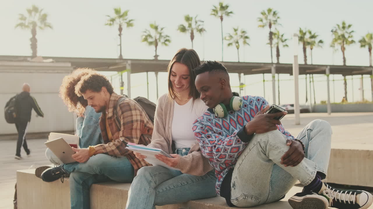Students Studying Outdoors Under Palm Trees