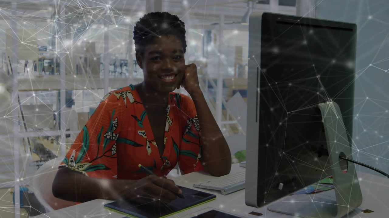 Vertical video: Woman using stylus on tablet, initiating design updates on monitor finalizing file