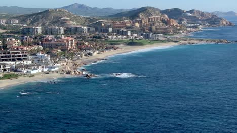 cinematic scenic view of the sea of cortez in los cabos, beachfront over cabo, mexico, aerial view