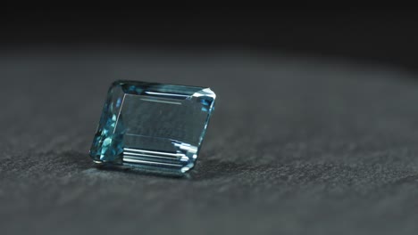 polished blue gemstone rotates and sparkles