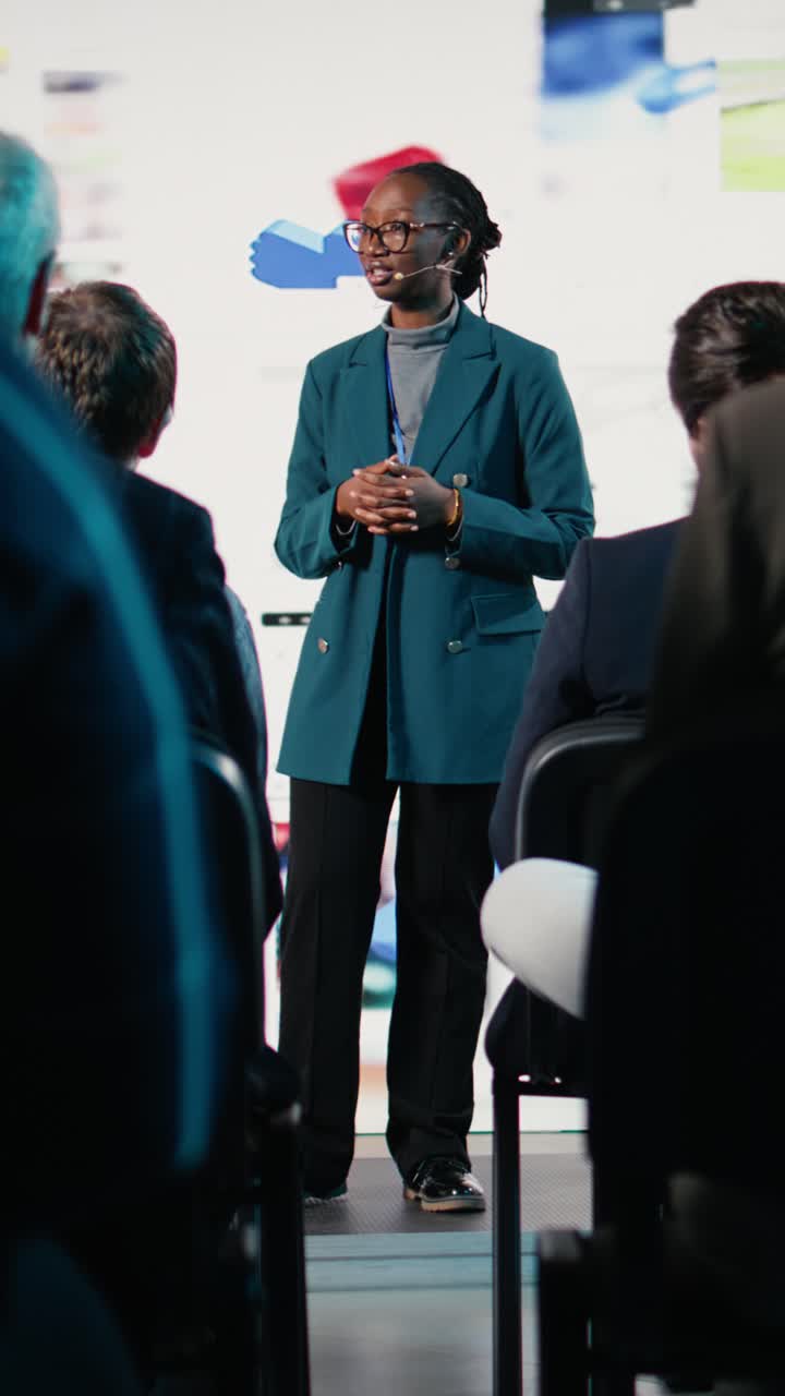 Vertical Video African American female speaker delivers powerful media presentation