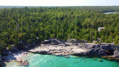 aerial georgian bay, canada blue water, people swimming, white pine forest