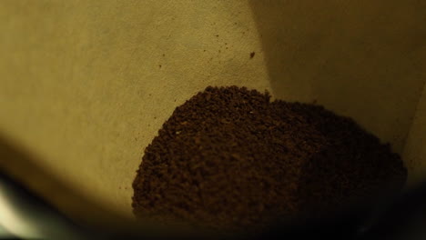 coffee powder pouring in paper filter