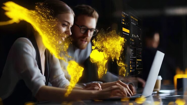 Samarbejdende hold analyserer datatendenser på bærbar computer med dynamiske globale visualiseringer i et moderne arbejdsmiljø, der fremhæver teknologi og kommunikation i erhvervslivet