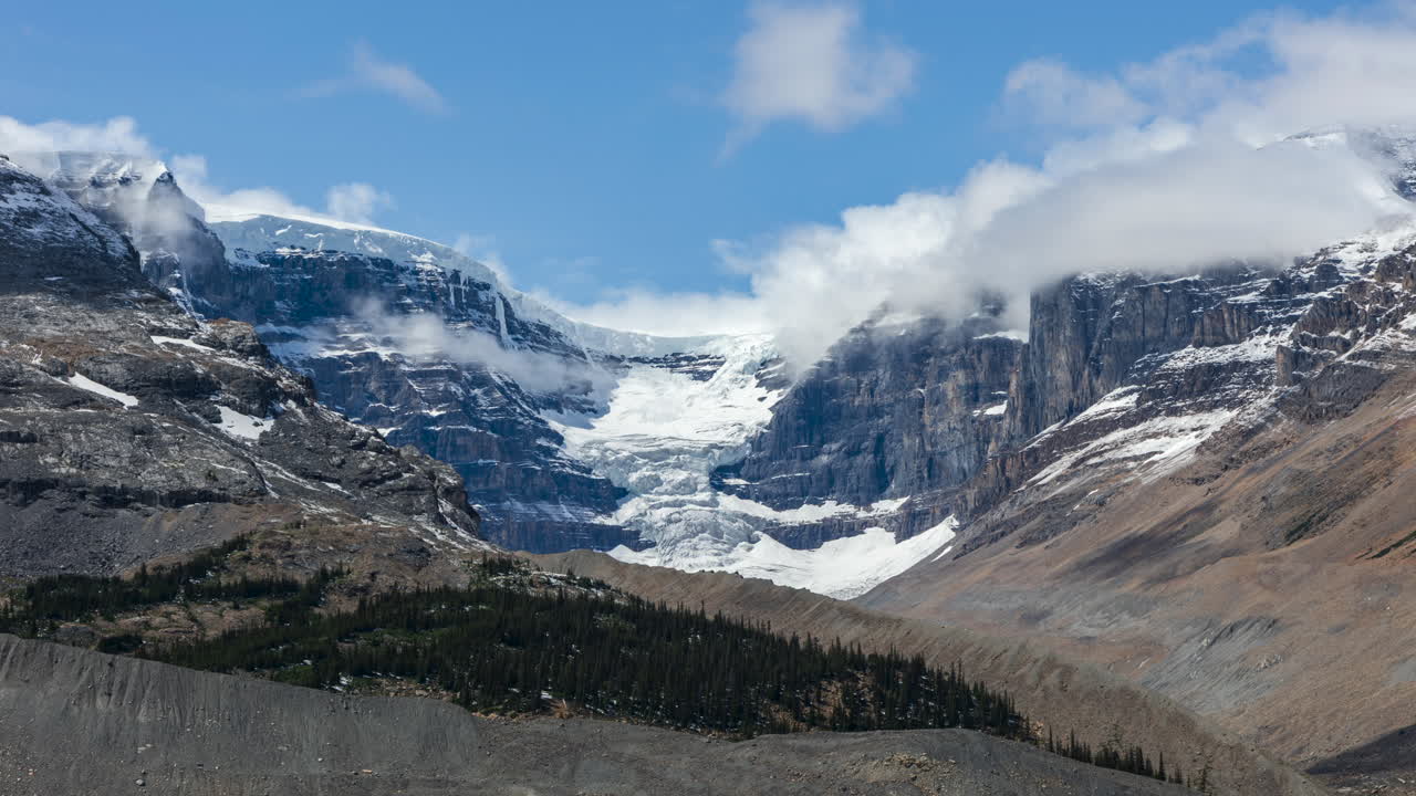 Timelapse capturing clouds drifting over Snow Dome and Dome glacier along the scenic Icefields Parkway