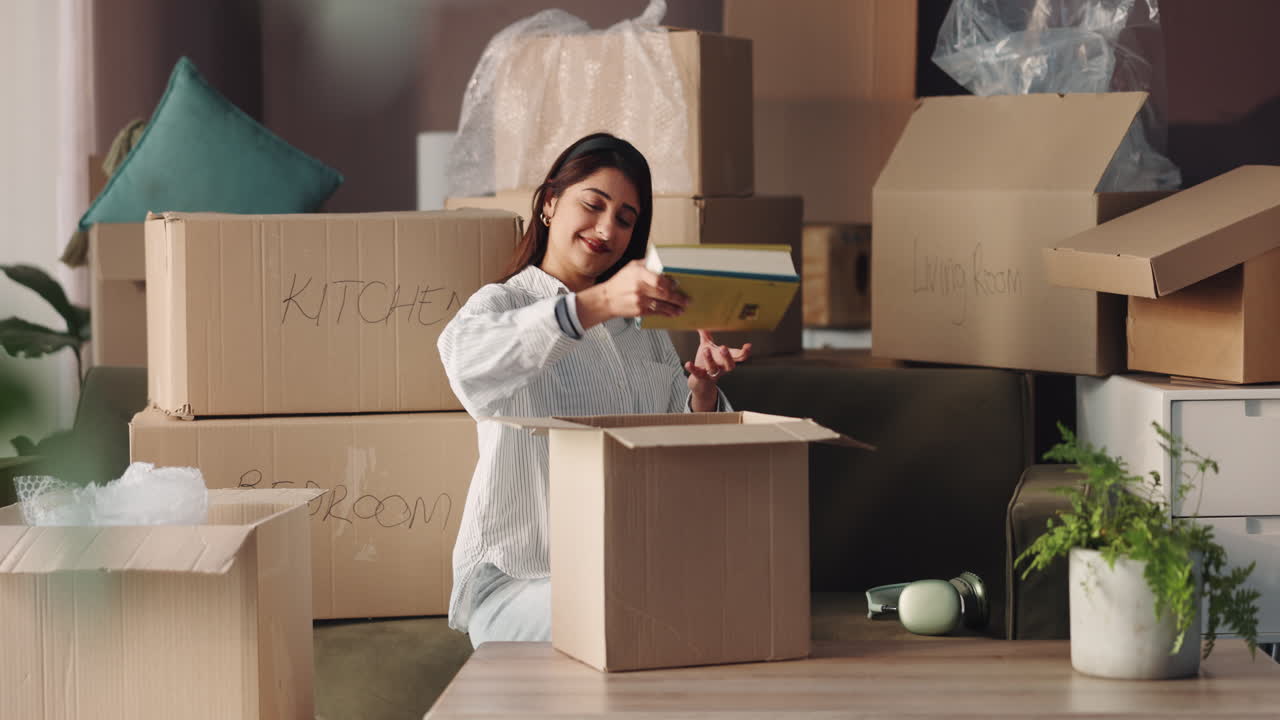 Woman packing boxes for moving