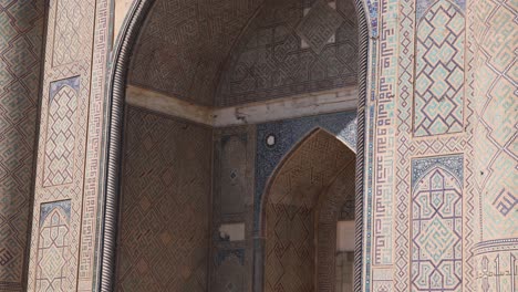 tiled archway of an ancient madrassa school of islamic thought in samarkand, uzbekistan along the historic silk road