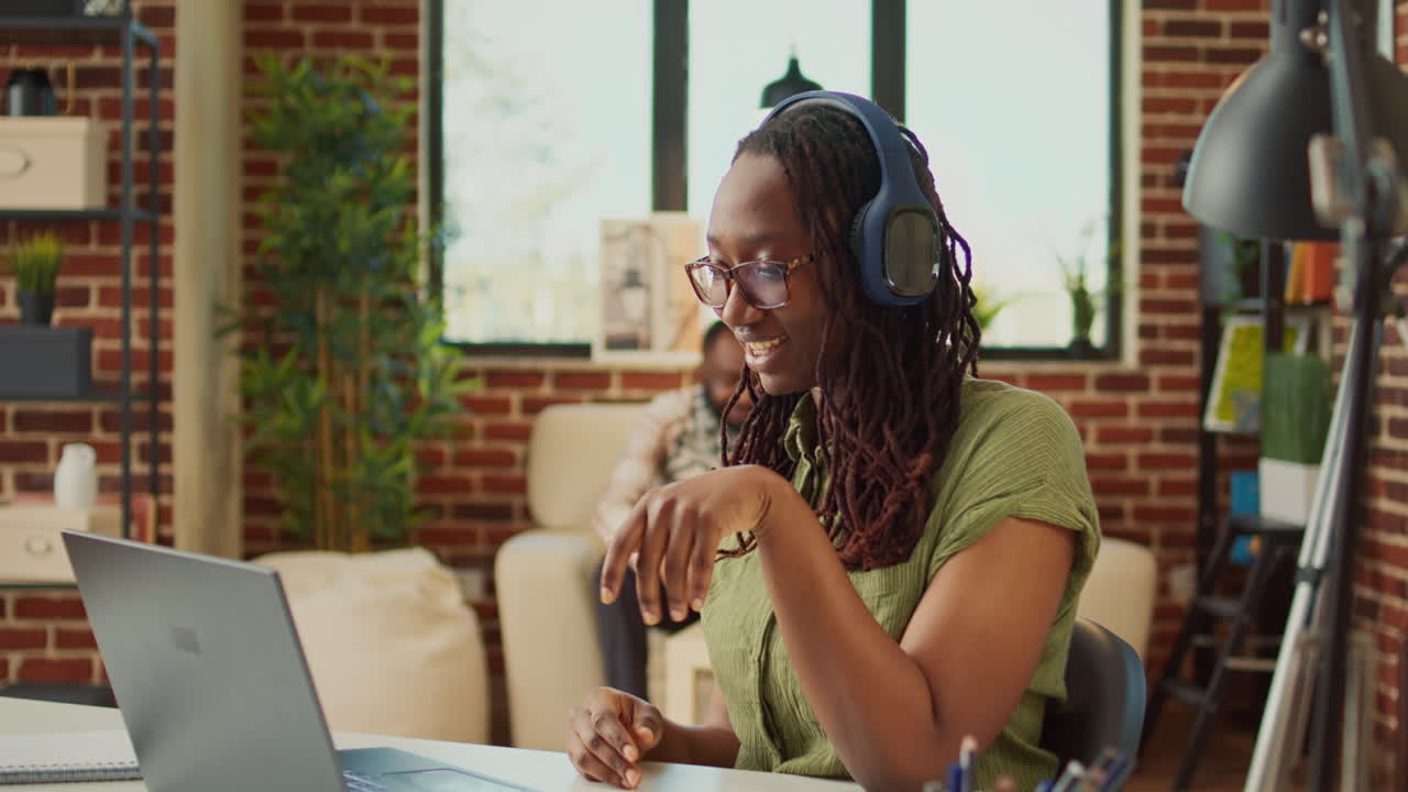 Woman talking to people on online videocall meeting