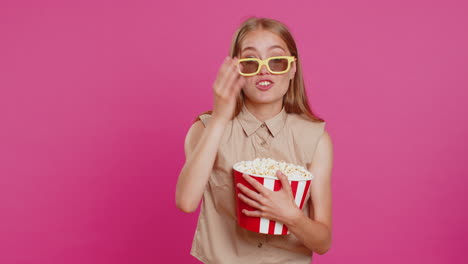 woman in 3d glasses eating popcorn and watching interesting tv serial, sport game film, online movie