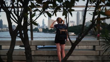 young female backpacker traveling in bangkok thailand