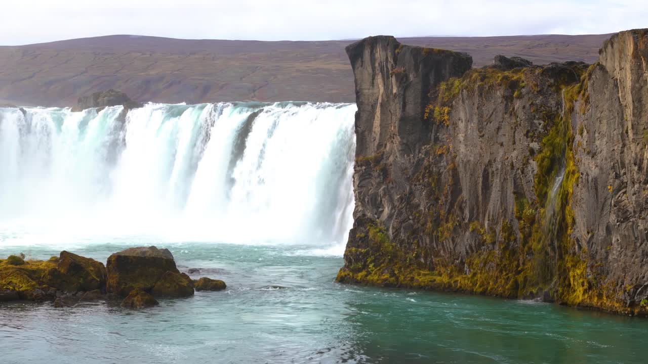 Low orbiting shot of famous tourist location Go&eth;afoss Waterfall, Iceland