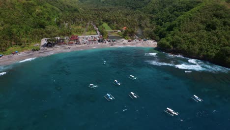 traditional outrigger boats - crystal bay beach in nusa penida islands, bali indonesia