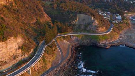 winding roads of sea cliff bridge and lawrence hargrave drive bridge at sunrise in australia