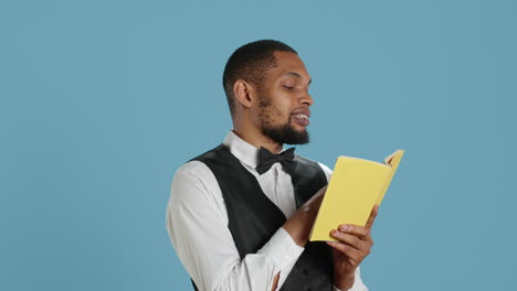 Doorkeeper-classy-staff-enjoying-a-literature-book-against-blue-background