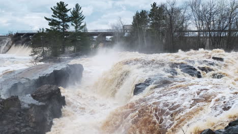 High-spring-floodwaters-surround-a-local-dam