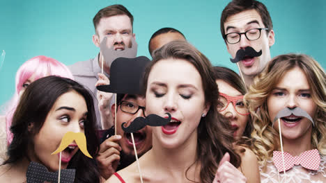 Multi-racial-group-of-funny-people-celebrating-slow-motion-party-photo-booth