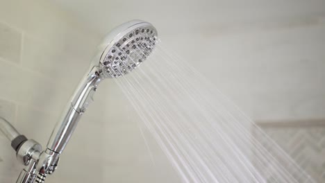 chrome shower head in the bathroom is hard on