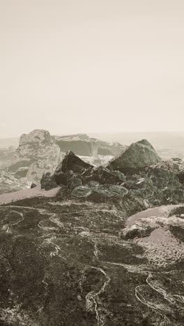 a desolate landscape of rocky formations in a dusty desert