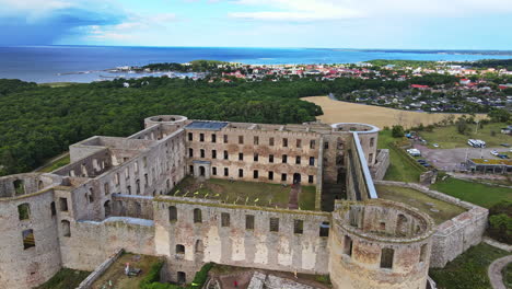 the ruins of borgholm castle with a scenic view of borgholm city and kalmar strait on summer in öland, sweden