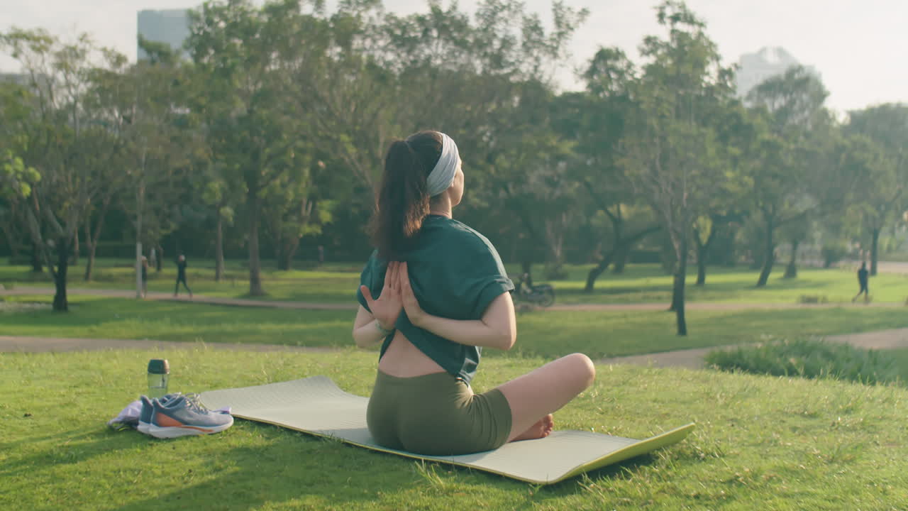 Woman Practicing Yoga in Park