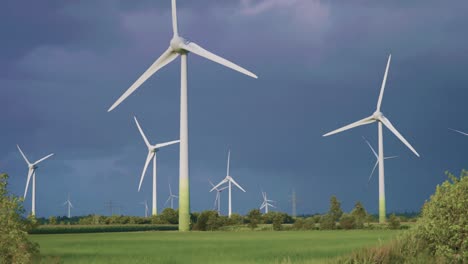 rotating wind turbines in the green field