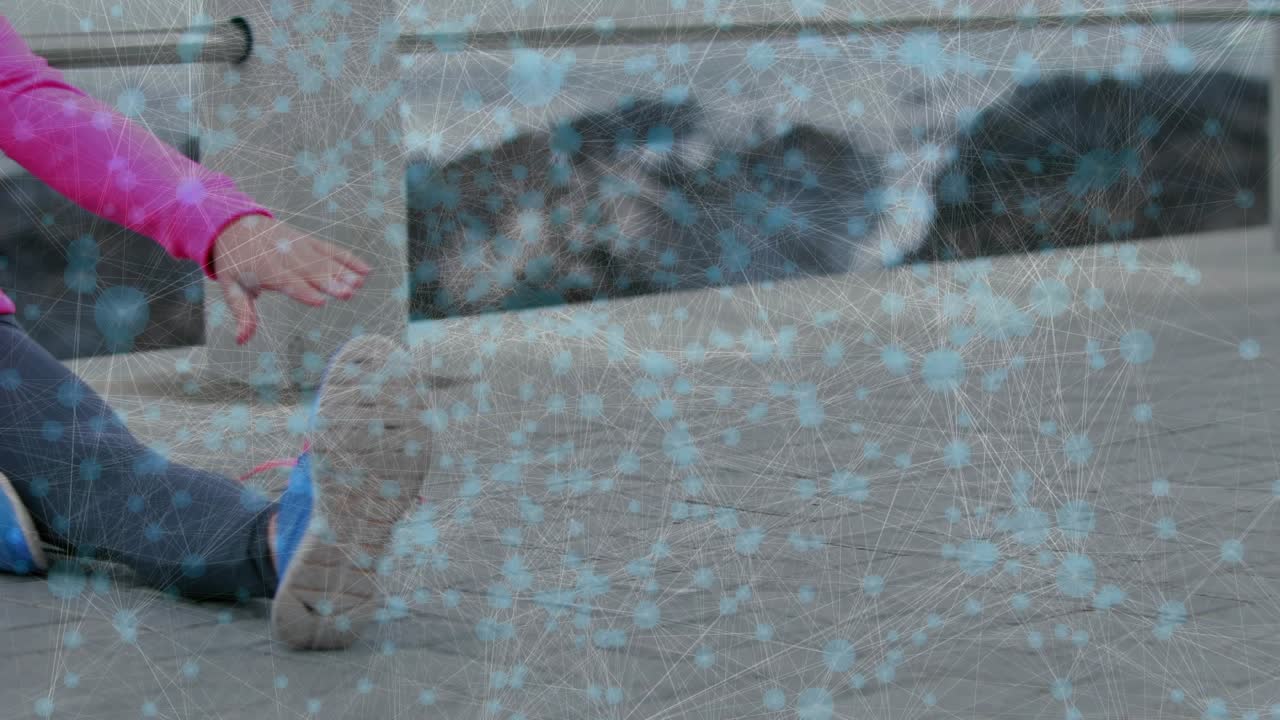 Female runner starting pre-run warmup, performing seated toe reaches, blue nodes tracing leg