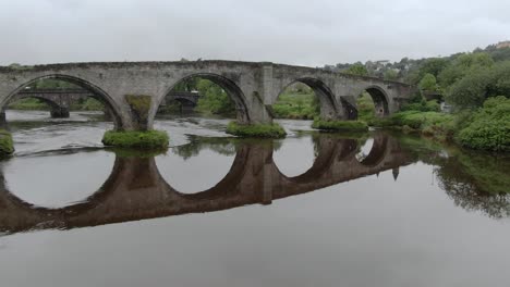 slow motion, flying under stirling old bridge in scotland