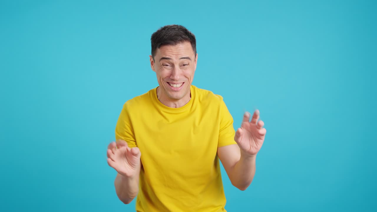 Man expressing negative emotions on blue background