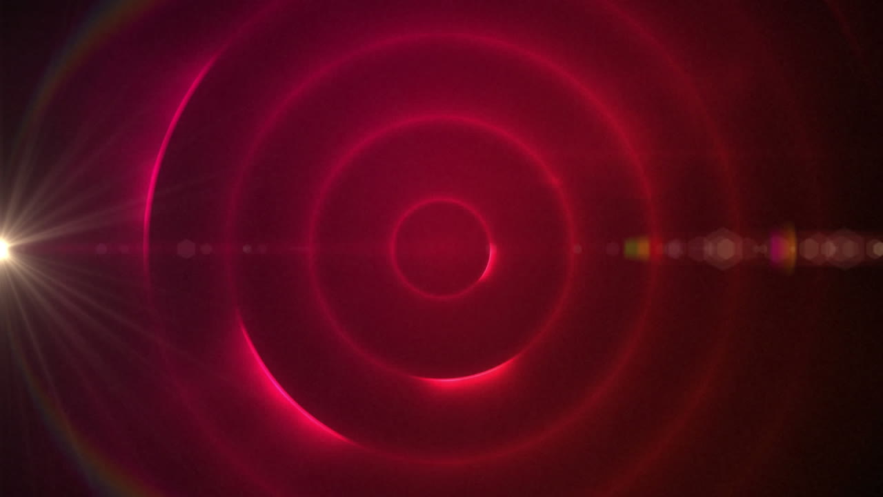 animación digital del punto de luz y el destello de la lente contra rastros de luz en espiral sobre fondo rojo