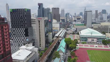 bangkok city skyline with transportation infrastructure and sports complex