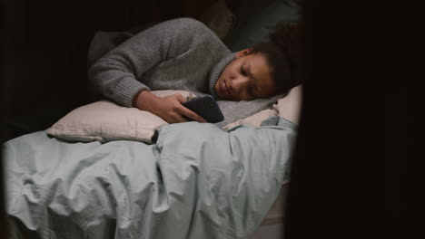 young woman laying on the bedroom