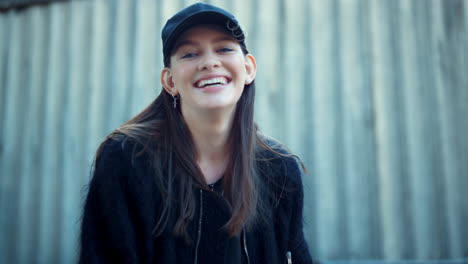 cheerful woman laughing outdoors