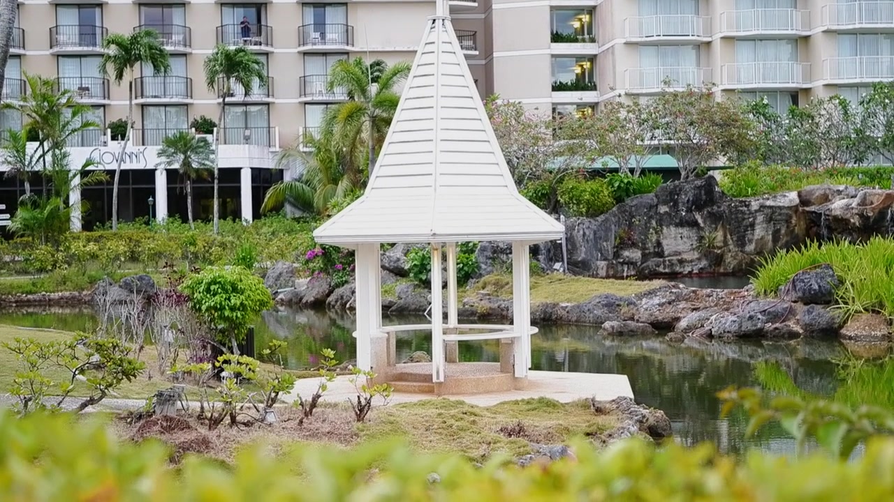 Beautiful white gazebo on the lake of the garden of Hyatt Regency at Saipan, Northern Mariana Islands