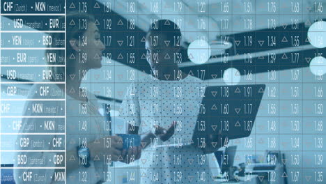 two professional women analyzing financial data in office, showing currency rate charts and arrows